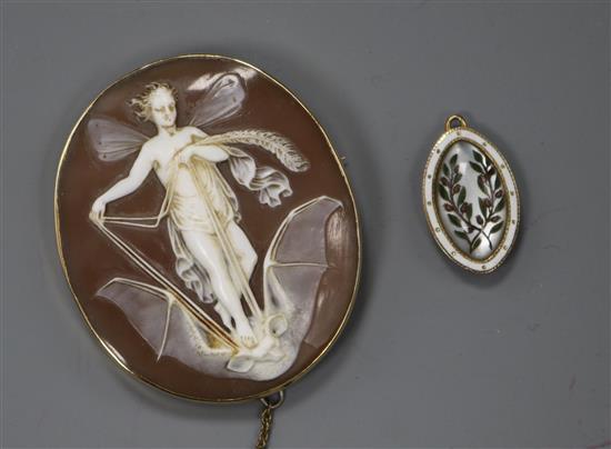An early 20th century yellow metal cameo brooch depicting a fairy on a bat in flight and enamelled pendant